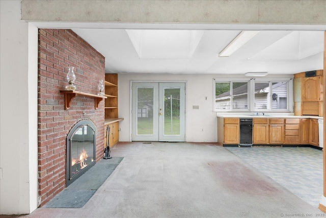 20 Cedar Ln, Norwich, CT 06360 - unfurnished living room with light carpet, french doors, a brick fireplace, and a sink
