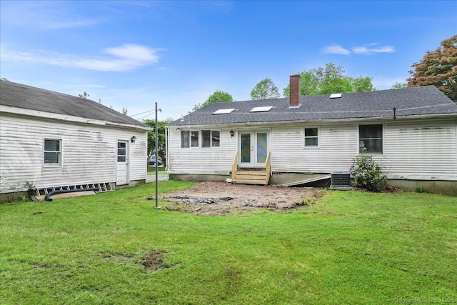 20 Cedar Ln, Norwich, CT 06360 - rear view of house with entry steps, a chimney, a yard, and cooling unit