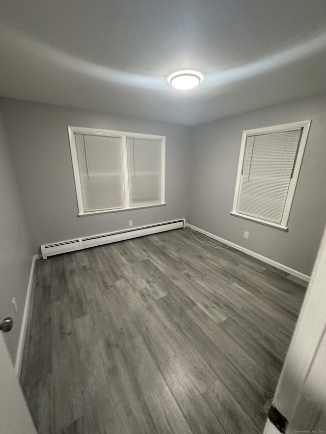 74 Saltonstall Ave, New Haven, CT 06513 - empty room with baseboard heating, wood finished floors, and baseboards