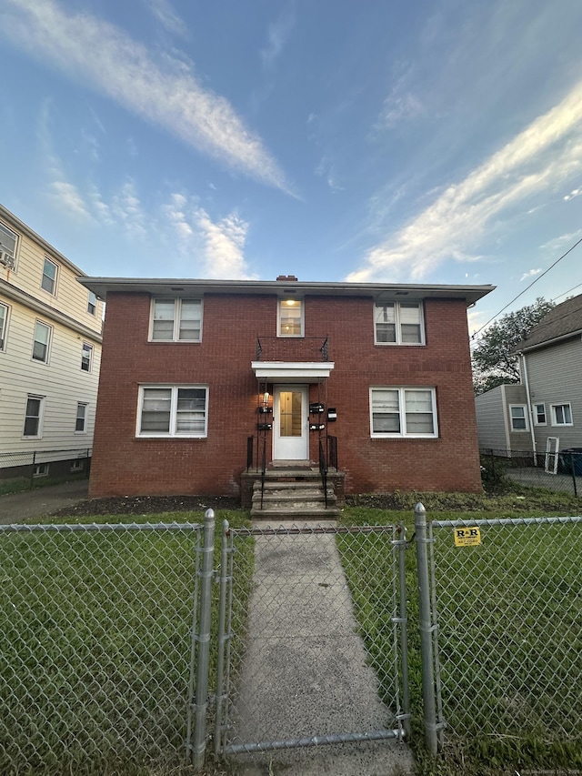 74 Saltonstall Ave, New Haven, CT 06513 - view of front facade with a gate and brick siding