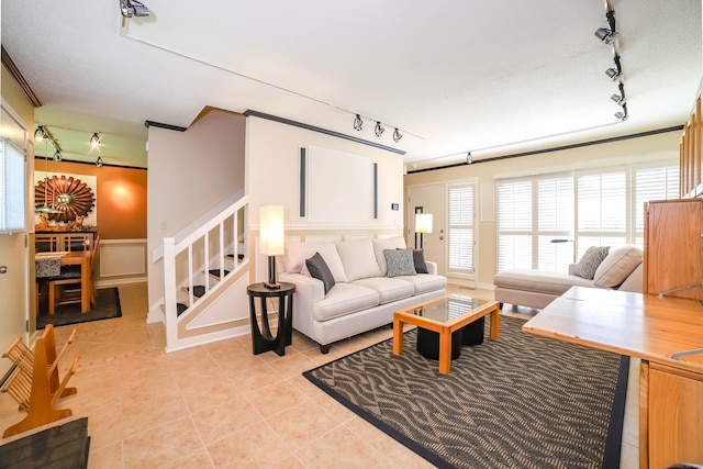 85 Viscount Dr Unit 10A, Milford, CT 06460 - living room with track lighting, stairs, a decorative wall, and light tile patterned flooring