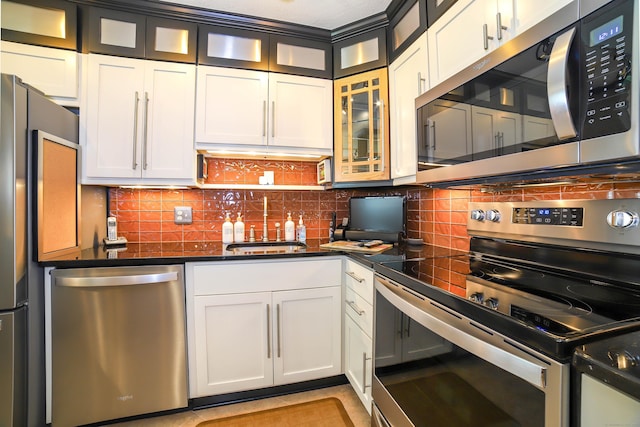 85 Viscount Dr Unit 10A, Milford, CT 06460 - kitchen featuring appliances with stainless steel finishes, a sink, dark countertops, and tasteful backsplash
