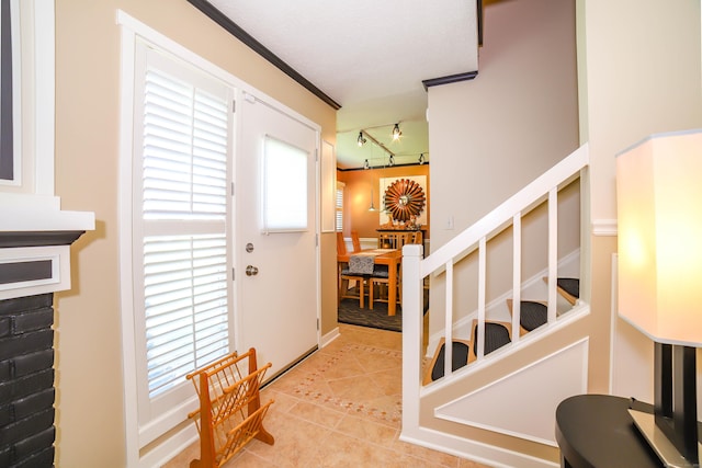 85 Viscount Dr Unit 10A, Milford, CT 06460 - foyer featuring tile patterned flooring, ornamental molding, healthy amount of natural light, and baseboards