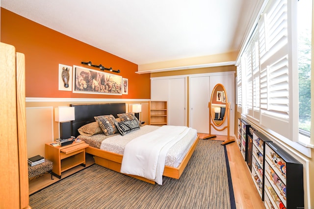 85 Viscount Dr Unit 10A, Milford, CT 06460 - bedroom featuring wood finished floors and wainscoting