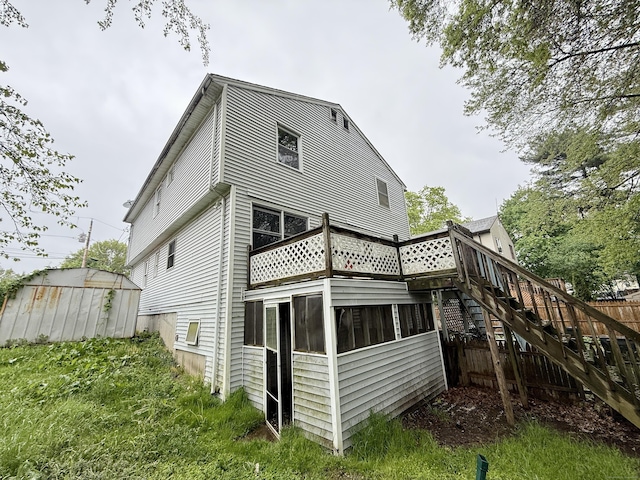 back of house with stairway and a deck