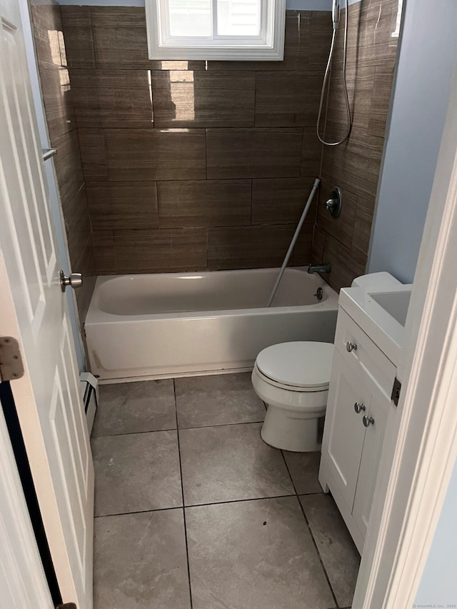 full bath featuring toilet, tile patterned flooring, bathing tub / shower combination, vanity, and a baseboard heating unit