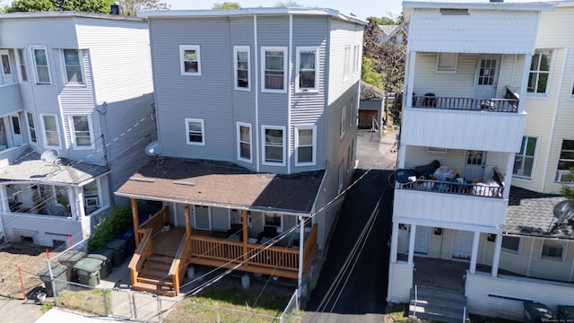 back of house with a balcony and stairway