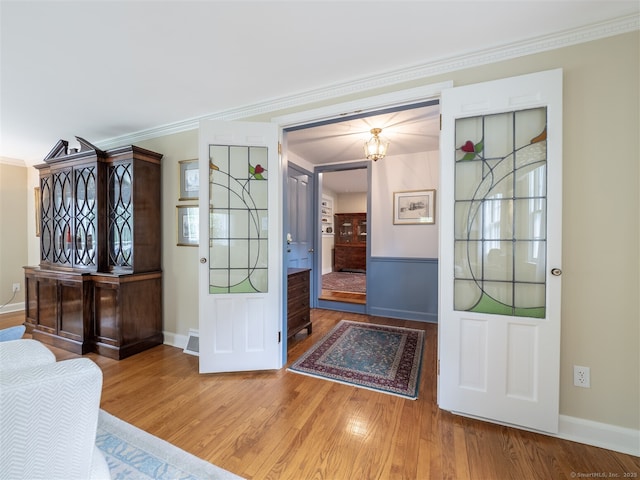 61 Nod Hill Rd, Wilton, CT 06897 - entryway with wood finished floors, crown molding, and baseboards