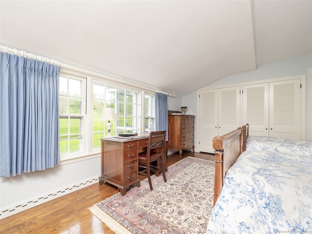 61 Nod Hill Rd, Wilton, CT 06897 - bedroom with lofted ceiling, multiple closets, wood finished floors, and a baseboard heating unit