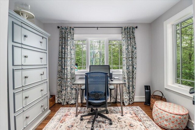 office with dark wood-type flooring