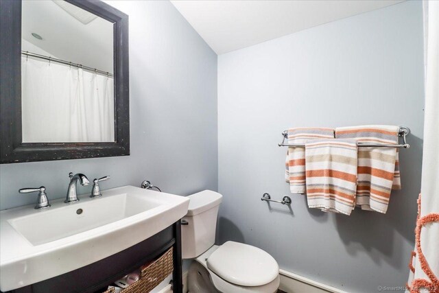 full bath featuring toilet and vanity