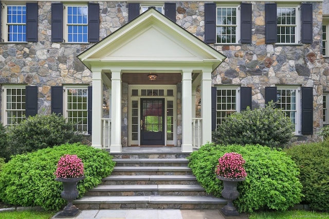 6 Spectacle Ln, Ridgefield, CT 06877 - doorway to property with stone siding and a porch