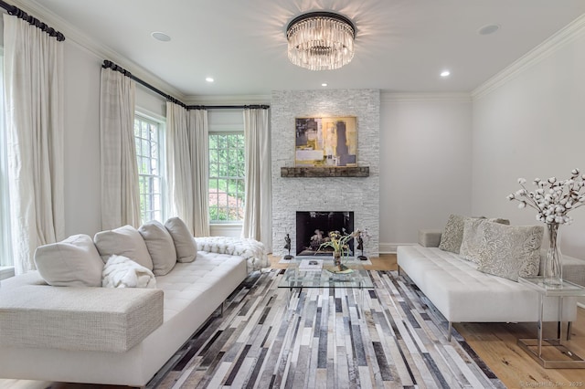 6 Spectacle Ln, Ridgefield, CT 06877 - living area featuring ornamental molding, a stone fireplace, wood finished floors, and a chandelier
