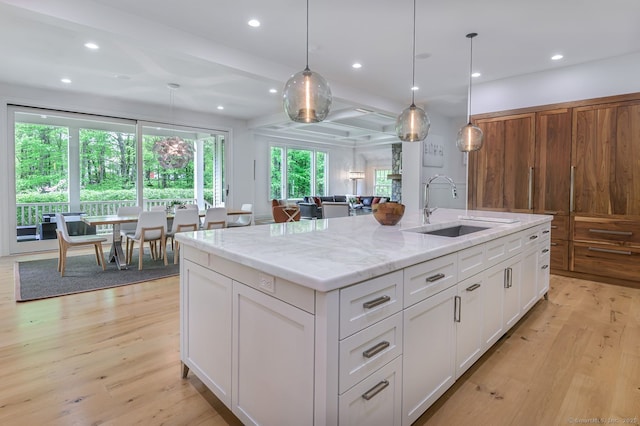 6 Spectacle Ln, Ridgefield, CT 06877 - kitchen featuring a sink, light wood finished floors, white cabinets, light stone countertops, and recessed lighting