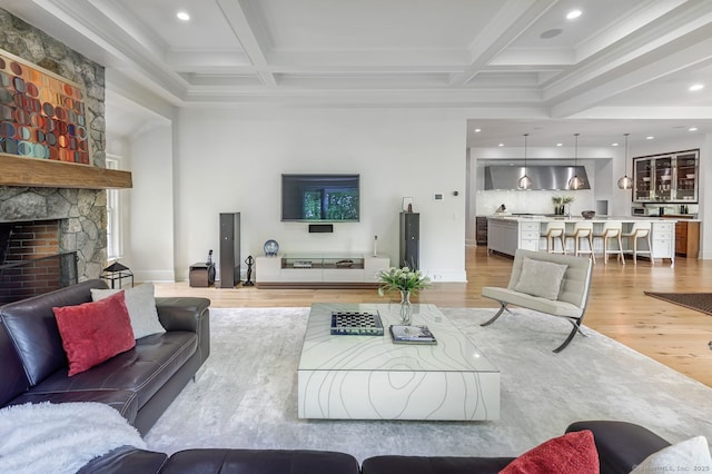 6 Spectacle Ln, Ridgefield, CT 06877 - living area with light wood-type flooring, beamed ceiling, coffered ceiling, a fireplace, and recessed lighting