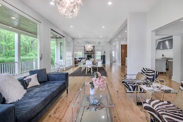 6 Spectacle Ln, Ridgefield, CT 06877 - living area featuring light wood finished floors, a chandelier, recessed lighting, and a fireplace