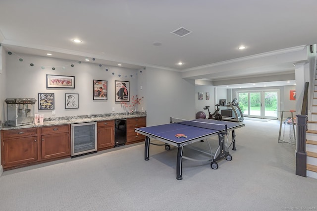 6 Spectacle Ln, Ridgefield, CT 06877 - recreation room with wine cooler, light carpet, wet bar, crown molding, and recessed lighting