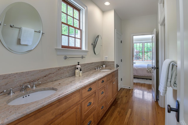 6 Spectacle Ln, Ridgefield, CT 06877 - full bathroom with wood finished floors, double vanity, recessed lighting, and baseboards