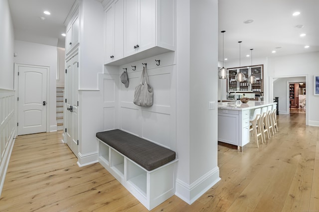 6 Spectacle Ln, Ridgefield, CT 06877 - mudroom featuring light wood-style flooring, recessed lighting, and baseboards