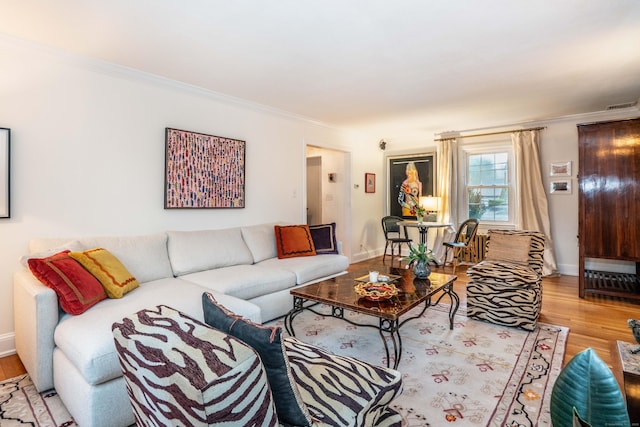 341 Quaker Ln N, West Hartford, CT 06119 - living area with crown molding, wood finished floors, and baseboards
