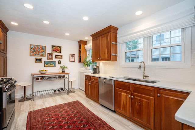 341 Quaker Ln N, West Hartford, CT 06119 - kitchen with stainless steel dishwasher, a sink, gas stove, decorative backsplash, and brown cabinets