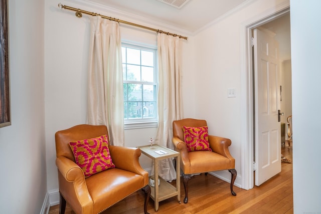 341 Quaker Ln N, West Hartford, CT 06119 - sitting room featuring light wood-type flooring, ornamental molding, and baseboards