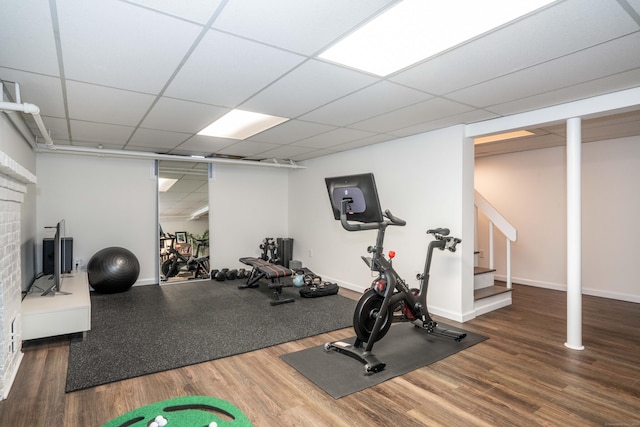 341 Quaker Ln N, West Hartford, CT 06119 - exercise room featuring wood finished floors, baseboards, and a drop ceiling