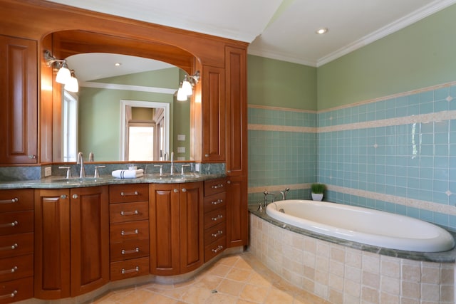 bathroom with ornamental molding, a garden tub, double vanity, and tile patterned flooring