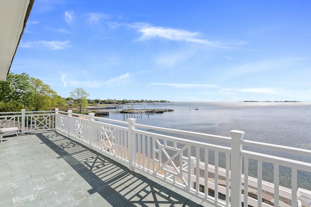 balcony featuring a water view