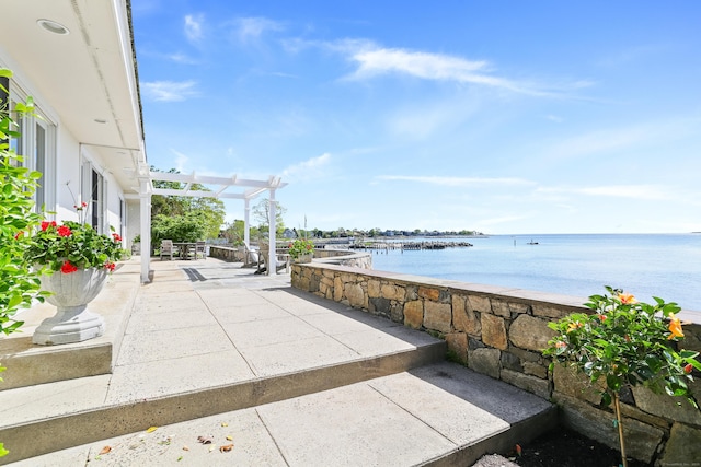 view of patio with a water view
