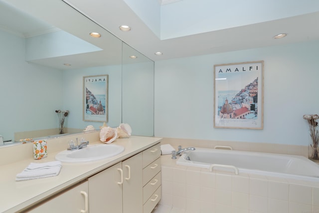 full bath with recessed lighting, vanity, a bath, crown molding, and a skylight