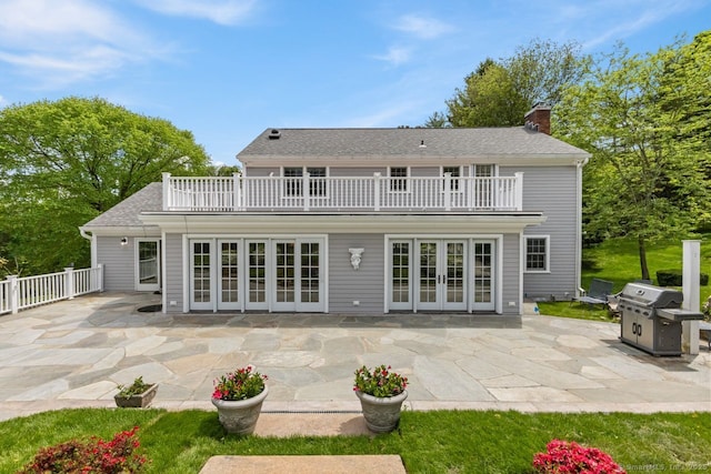 24 Lawrence Hill Rd, Stamford, CT 06903 - rear view of house with french doors, a balcony, and a patio area
