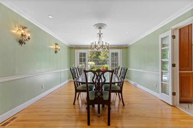 24 Lawrence Hill Rd, Stamford, CT 06903 - dining space with a chandelier, light wood-style flooring, crown molding, baseboards, and recessed lighting