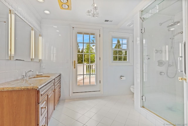 24 Lawrence Hill Rd, Stamford, CT 06903 - bathroom with crown molding, tile patterned floors, a shower stall, vanity, and tile walls