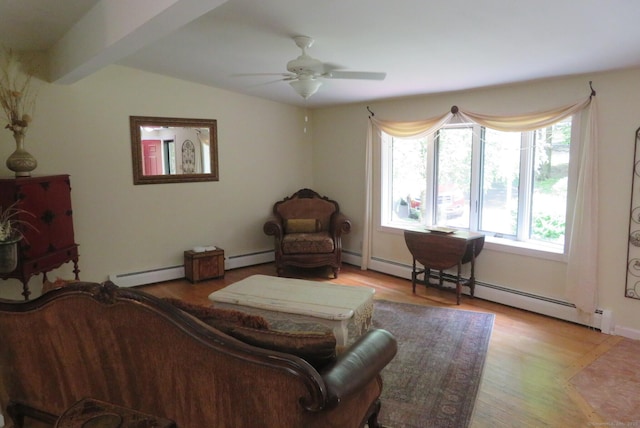 living room featuring ceiling fan, light wood-style floors, baseboard heating, and vaulted ceiling