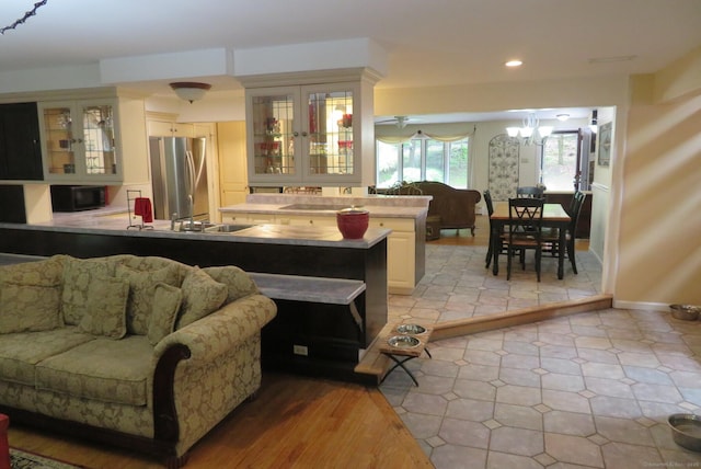living area featuring recessed lighting and a chandelier