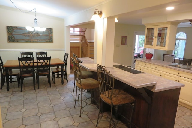 dining space featuring stairway, plenty of natural light, a chandelier, and recessed lighting