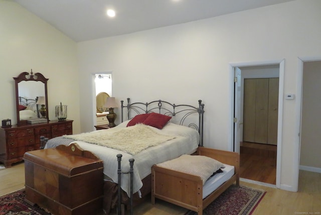 bedroom with light wood-type flooring, baseboards, and recessed lighting