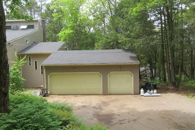 garage featuring driveway