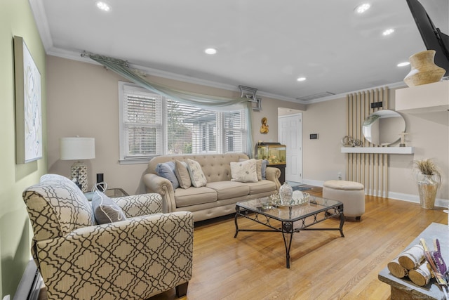 living room with ornamental molding, recessed lighting, wood finished floors, and baseboards