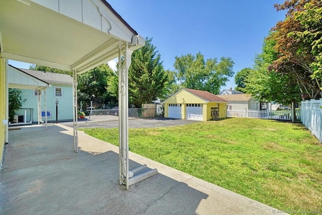 661 E Main St, Stratford, CT 06614 - view of yard with a garage and an outbuilding