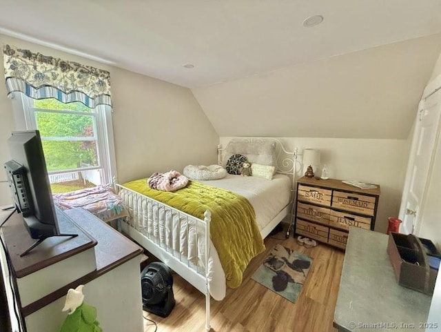 661 E Main St, Stratford, CT 06614 - bedroom with wood finished floors and lofted ceiling