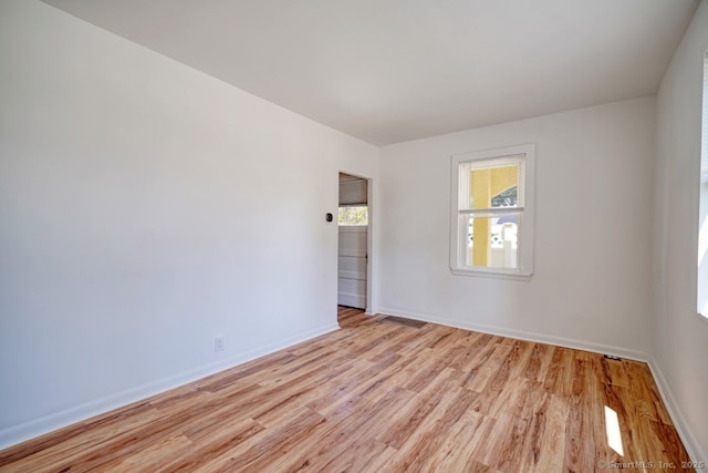 661 E Main St, Stratford, CT 06614 - empty room with light wood-style floors and baseboards