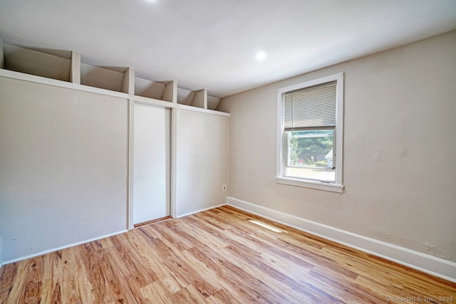 661 E Main St, Stratford, CT 06614 - empty room featuring wood finished floors, baseboards, and recessed lighting
