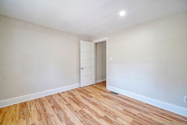 661 E Main St, Stratford, CT 06614 - empty room with baseboards, light wood finished floors, and recessed lighting