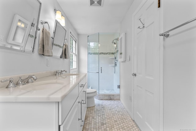 94 Glen Dr, New Canaan, CT 06840 - bathroom with a stall shower, toilet, double vanity, and tile patterned flooring