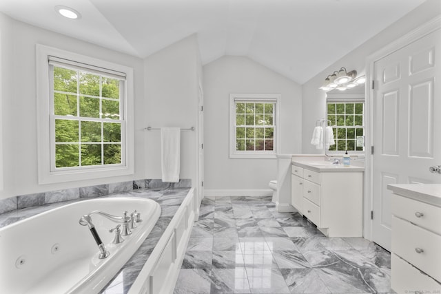 94 Glen Dr, New Canaan, CT 06840 - bathroom featuring vanity, a tub with jets, vaulted ceiling, toilet, and marble finish flooring