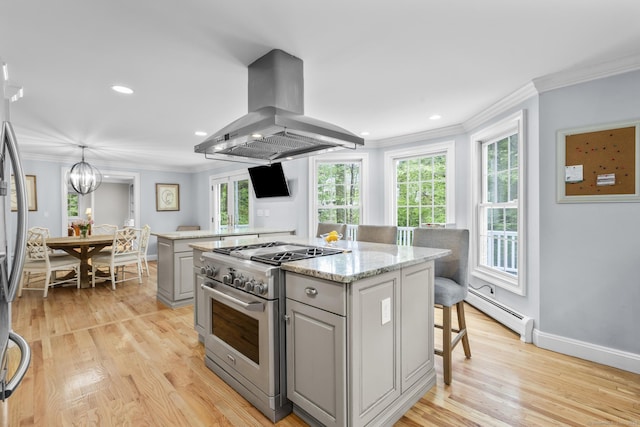 94 Glen Dr, New Canaan, CT 06840 - kitchen featuring appliances with stainless steel finishes, island exhaust hood, a baseboard radiator, gray cabinetry, and ornamental molding