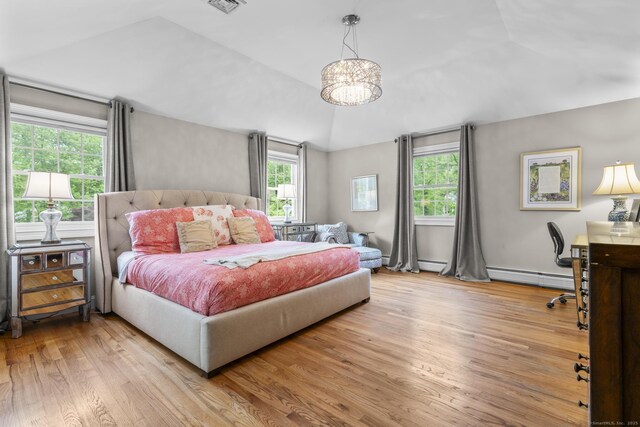 94 Glen Dr, New Canaan, CT 06840 - bedroom featuring lofted ceiling, a baseboard heating unit, wood finished floors, and a chandelier