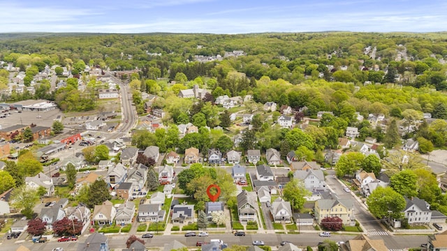 aerial view of residential area with a heavily wooded area